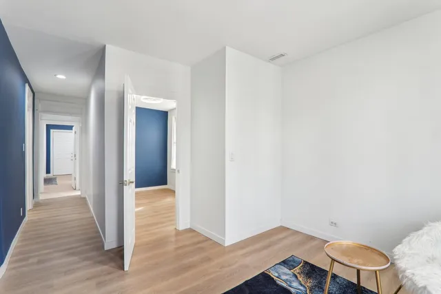 a view of livingroom with hardwood floor and bathroom