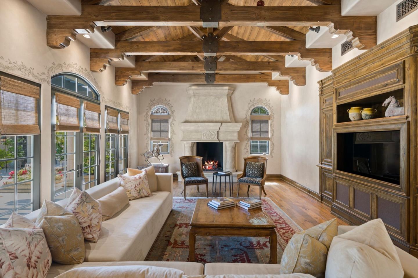 25751 Elena Road Los Altos Hills, CA 94022 - Photo 18 of 80 a living room with furniture and a fireplace
