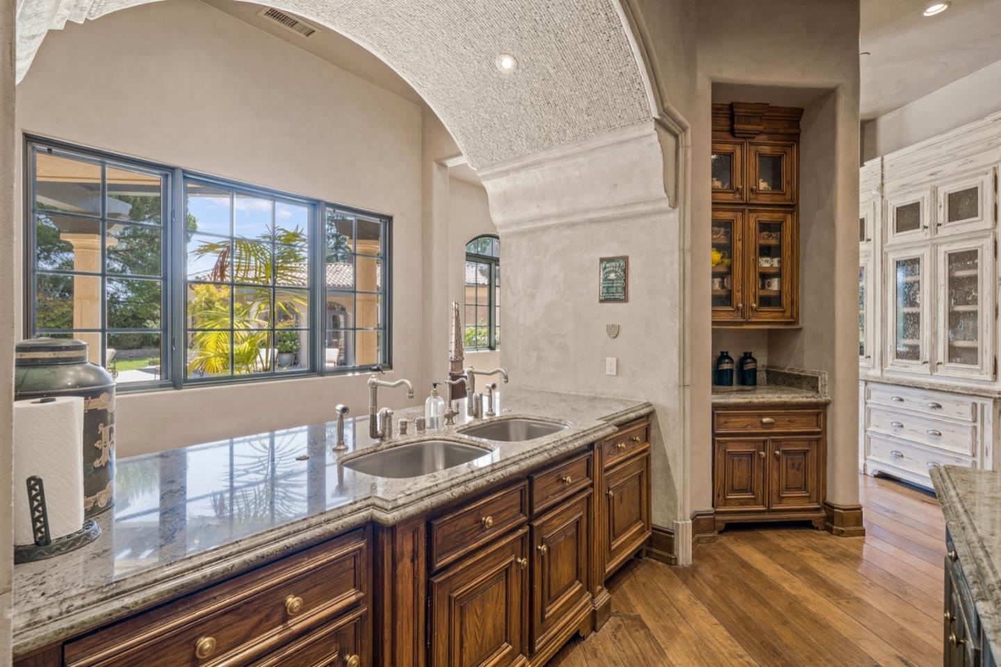 25751 Elena Road Los Altos Hills, CA 94022 - Photo 28 of 80 a spacious bathroom with a granite countertop sink and a large mirror