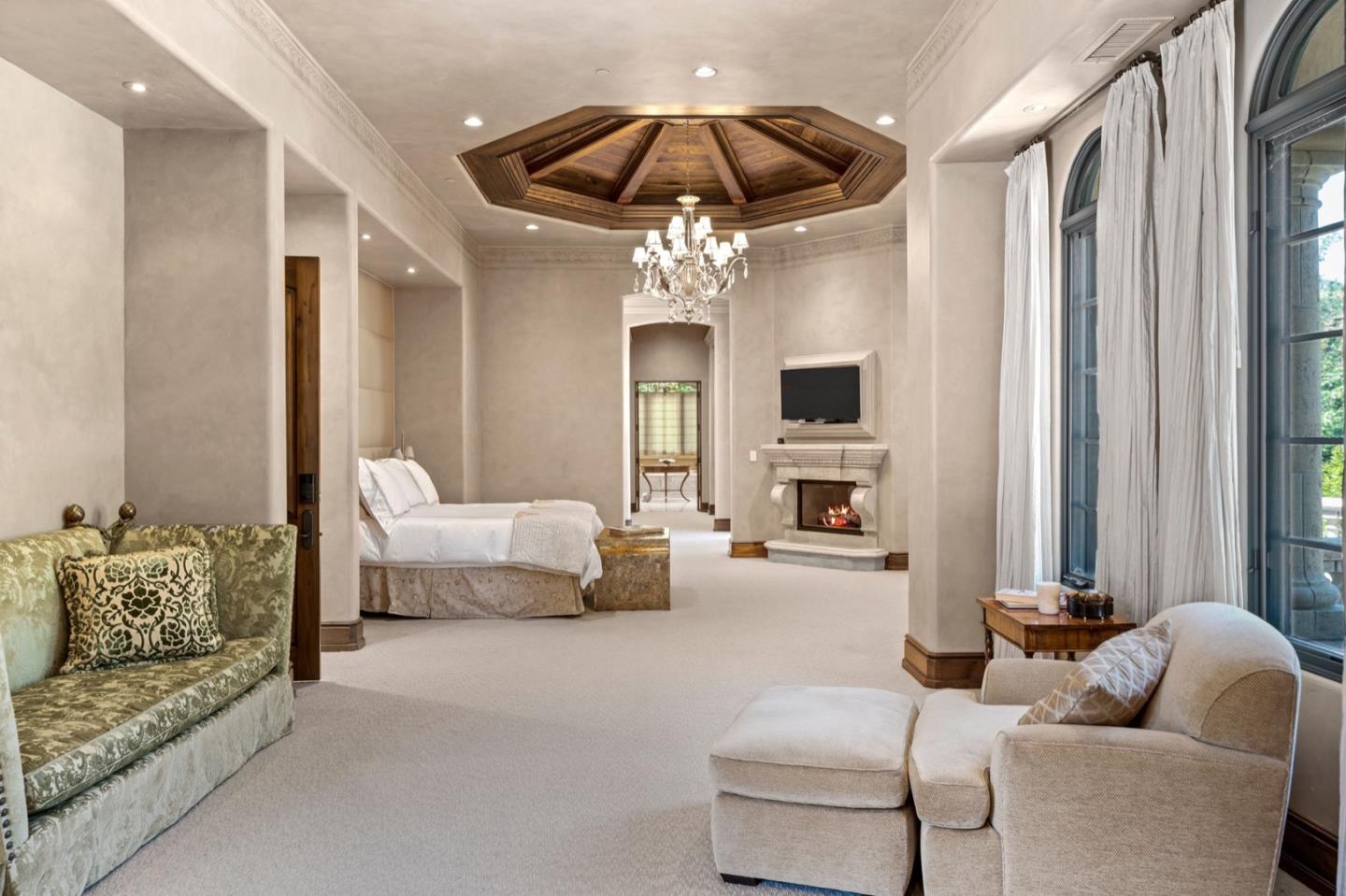 25751 Elena Road Los Altos Hills, CA 94022 - Photo 30 of 80 a living room with furniture and a chandelier