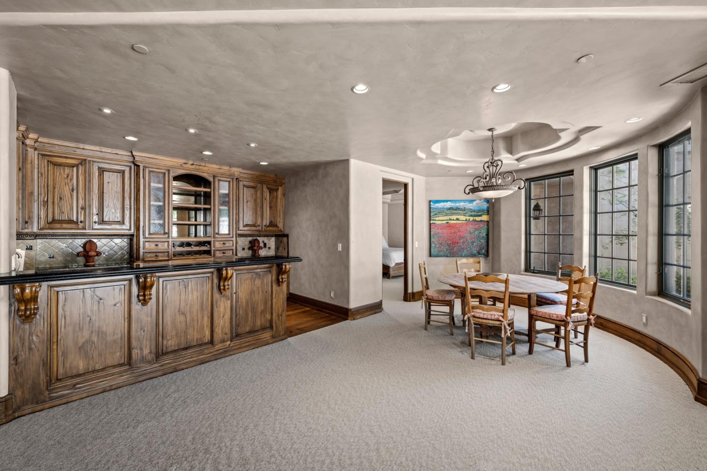 25751 Elena Road Los Altos Hills, CA 94022 - Photo 45 of 80 a kitchen with stainless steel appliances kitchen island granite countertop a sink and cabinets