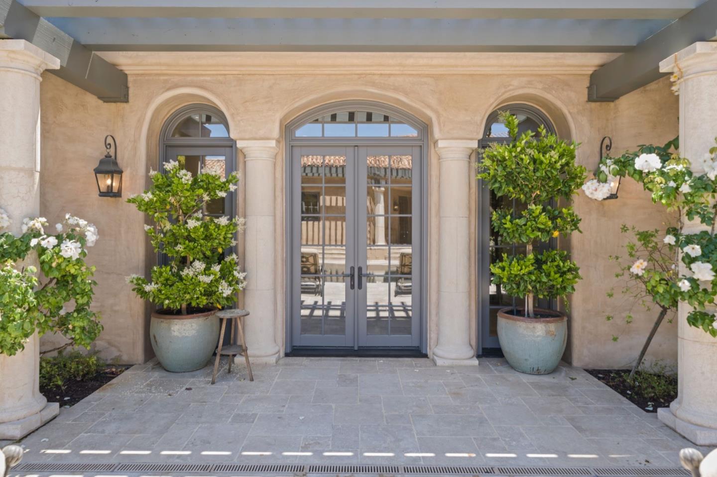 25751 Elena Road Los Altos Hills, CA 94022 - Photo 60 of 80 a view of a blue house with potted plants