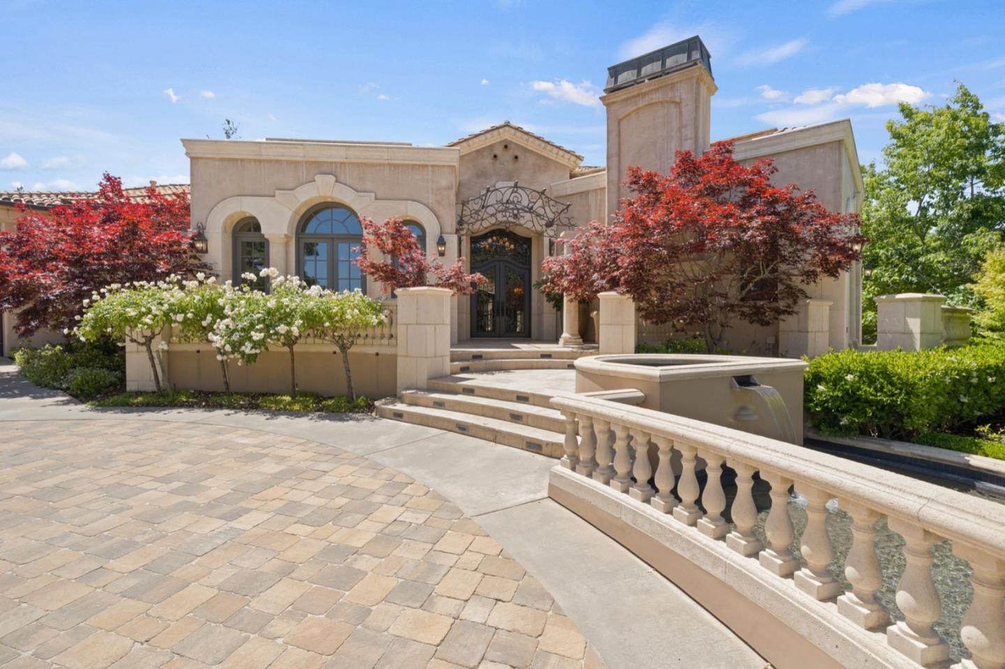 25751 Elena Road Los Altos Hills, CA 94022 - Photo 6 of 80 a front view of a house with a garden