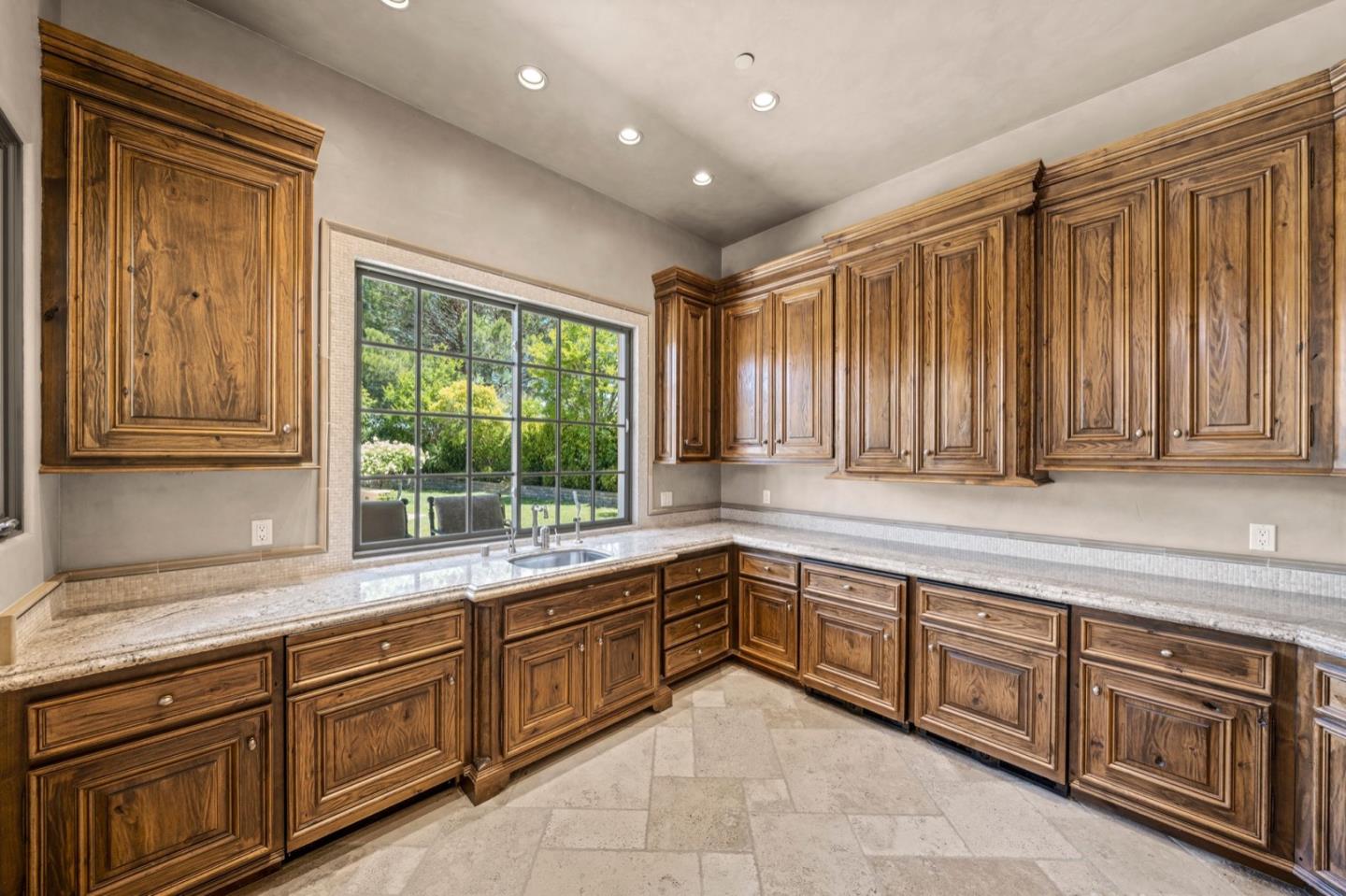 25751 Elena Road Los Altos Hills, CA 94022 - Photo 63 of 80 a large kitchen with stainless steel appliances granite countertop furniture and a large window