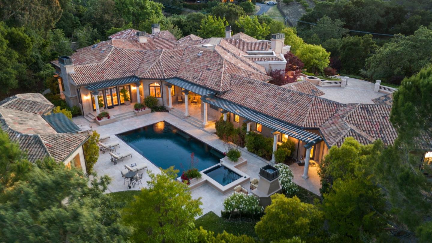 25751 Elena Road Los Altos Hills, CA 94022 - Photo 77 of 80 an aerial view of a house with a big yard and large trees