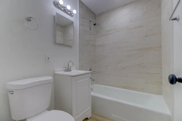 a bathroom with a sink toilet and bathtub