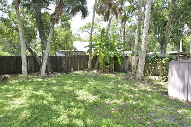 a backyard of a house with lots of green space