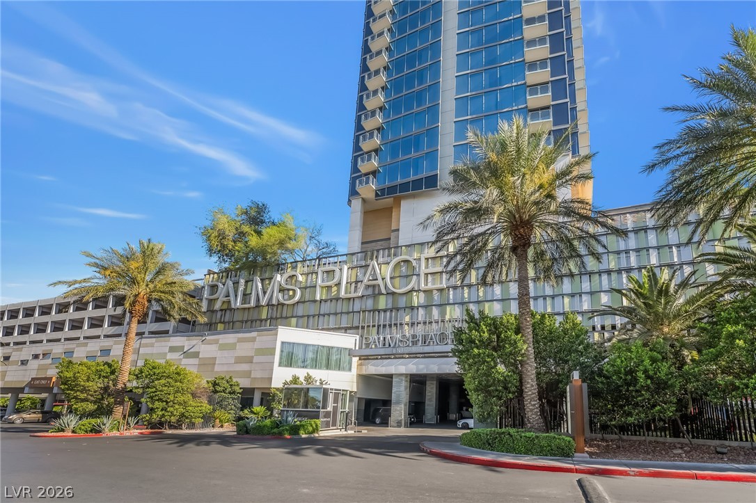 4381 West Flamingo Road, Unit 18305 Las Vegas, NV 89103 - Photo 1 of 19 An impressive high-rise with contemporary architecture stands tall amidst lush landscaping and palm trees.