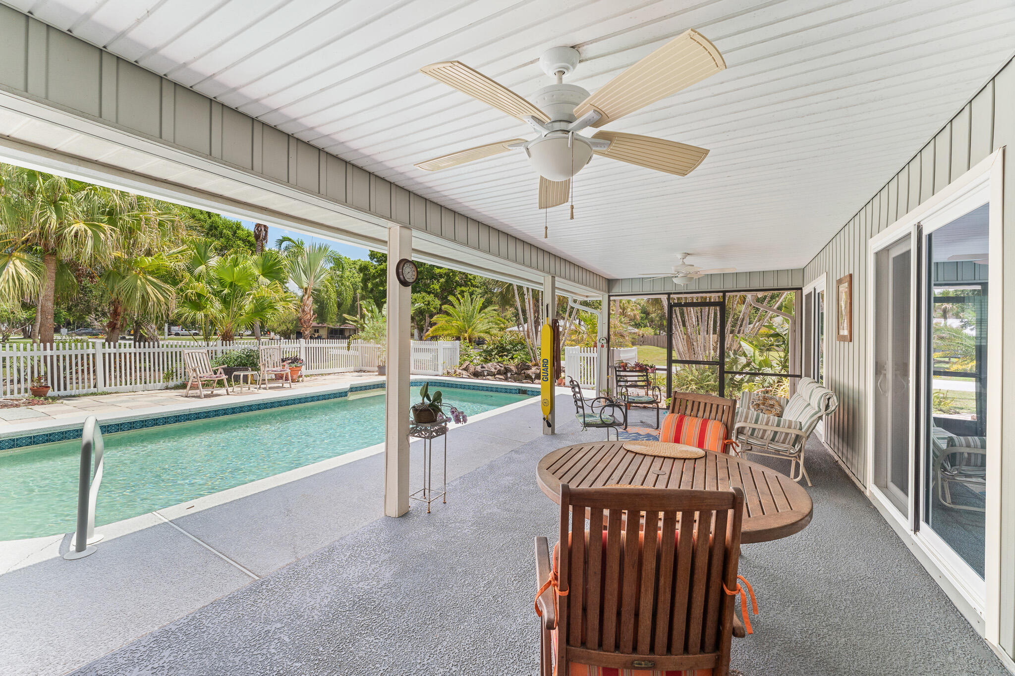 1653 Southwest 85th Terrace Stuart, FL 34997 - Photo 39 of 54 a view of a porch with furniture and a yard