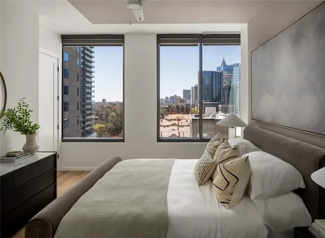 a bed sitting in a bedroom next to a window