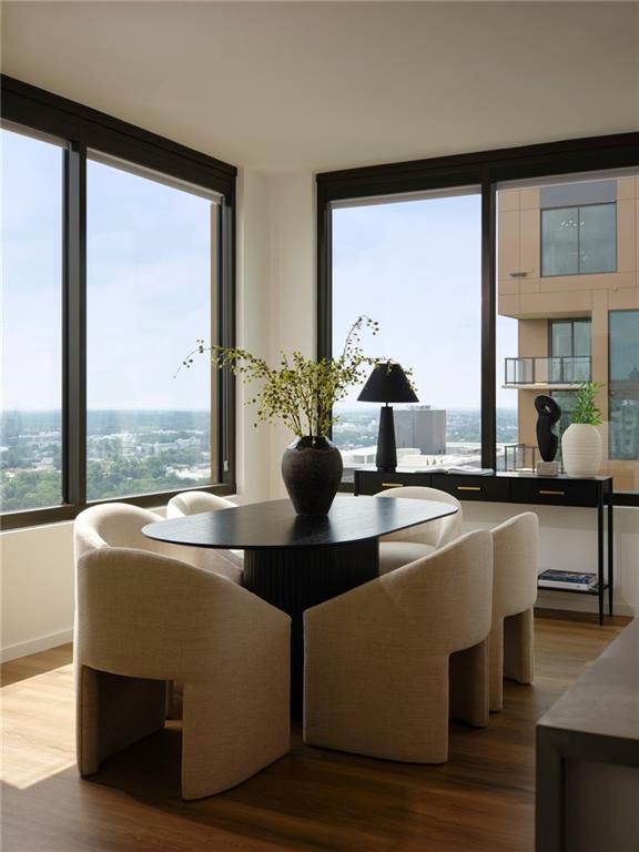 1081 Juniper Street Northeast, Unit S2C Atlanta, GA 30309 - Photo 3 of 46 a view of living room with furniture and large windows