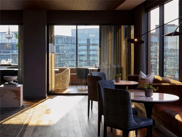 a dining room with furniture and window