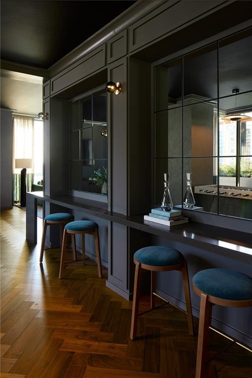 1081 Juniper Street Northeast, Unit S2C Atlanta, GA 30309 - Photo 37 of 46 a view of a dining room with furniture window and wooden floor