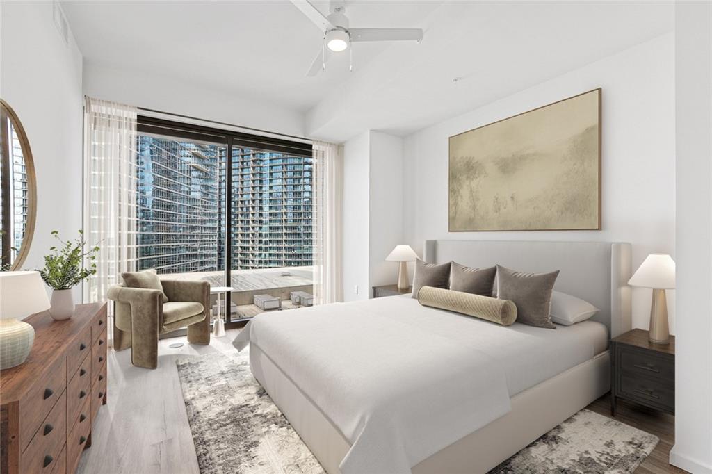 1081 Juniper Street Northeast, Unit S2C Atlanta, GA 30309 - Photo 8 of 46 a bedroom with a large bed and a large window