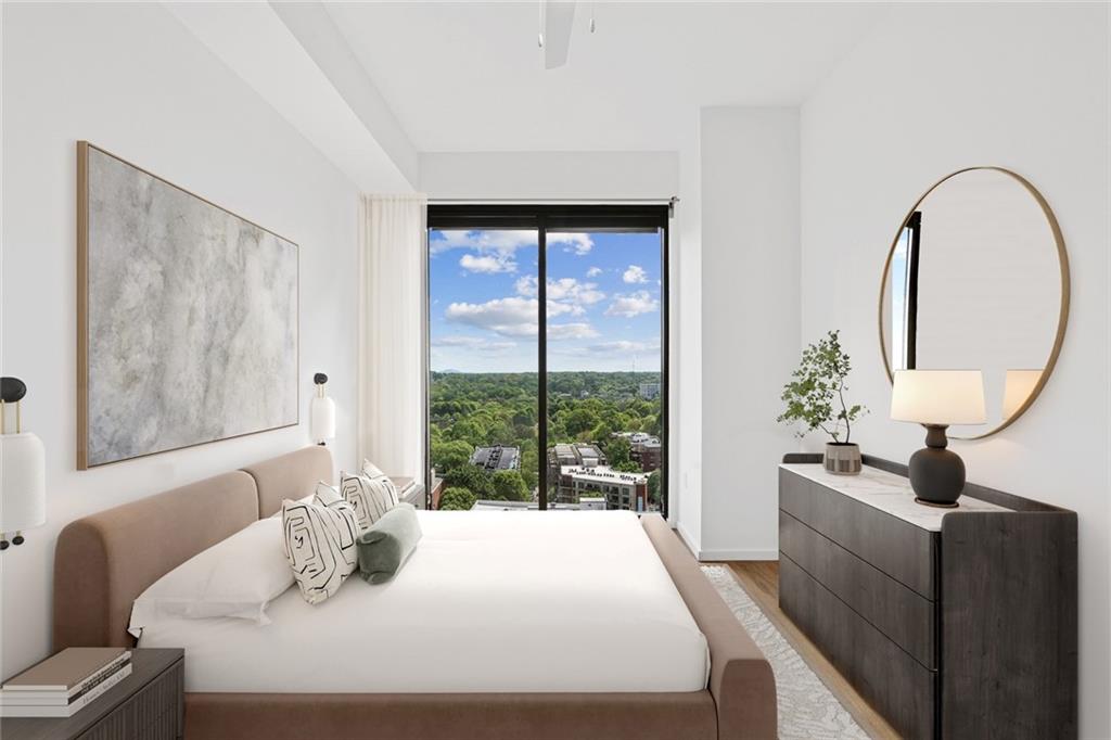 1081 Juniper Street Northeast, Unit S2C Atlanta, GA 30309 - Photo 9 of 46 a bedroom with a bed and a large window