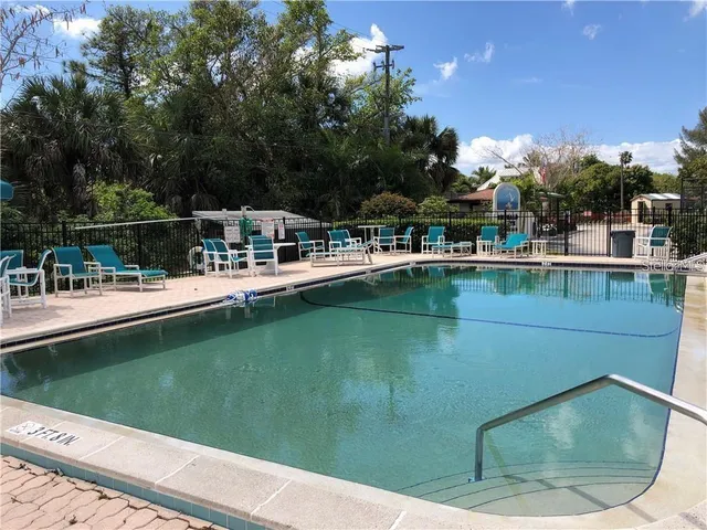 a view of a swimming pool with a patio