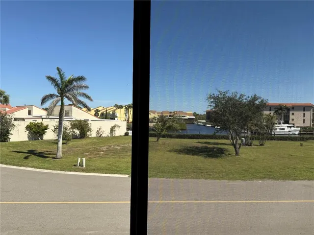 a view of swimming pool from a window
