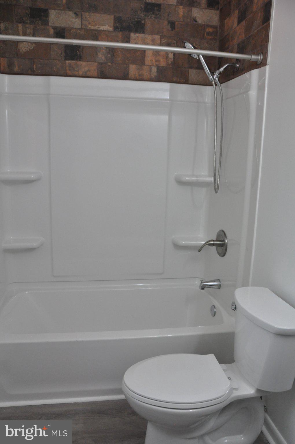 28 Henry Way Linden, VA 22642 - Photo 18 of 39 a bathroom with a toilet and a bathtub