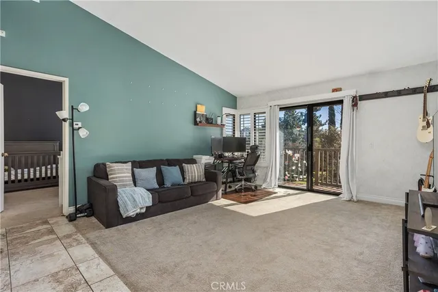 a view of livingroom with furniture and floor to ceiling window
