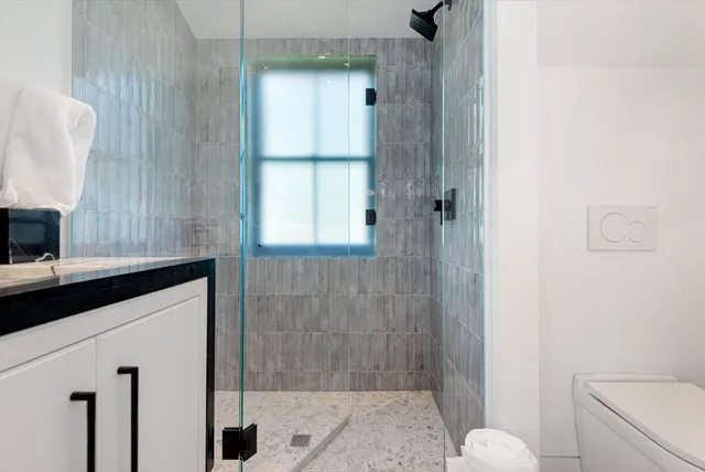 a bed room with a bed and a chair