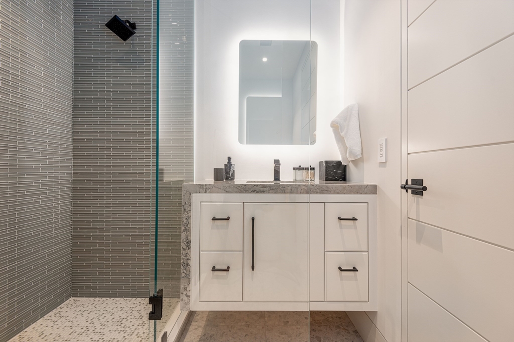 30 Devon Street, Unit THE DIPS Nantucket, MA 02554 - Photo 34 of 42 a bathroom with a sink and mirror