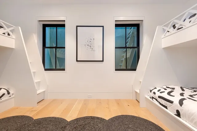 a bathroom with a bathtub sink and mirror