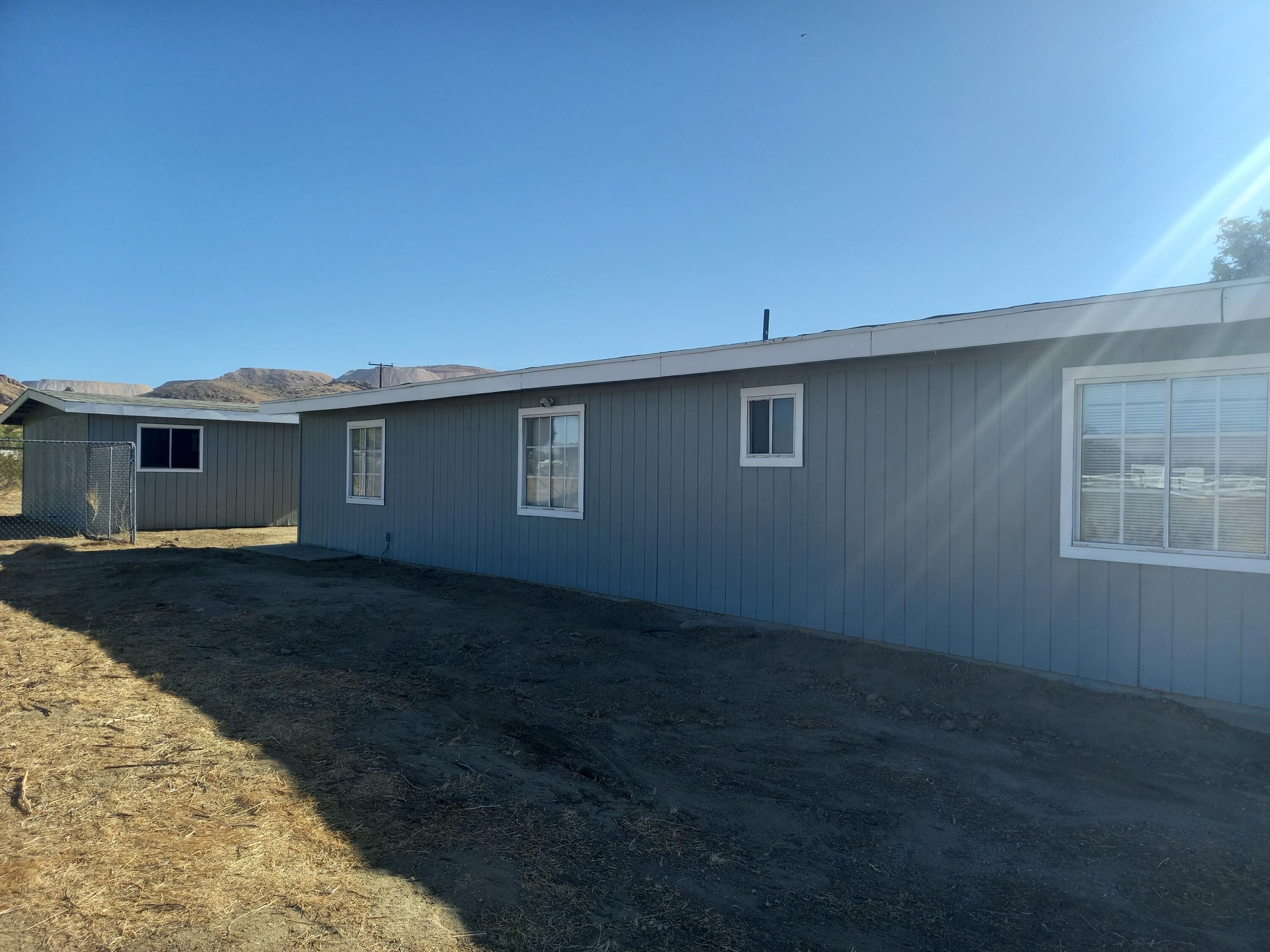 9073 Hull Street Mojave, CA 93501 - Photo 15 of 16 front view of a house with a yard