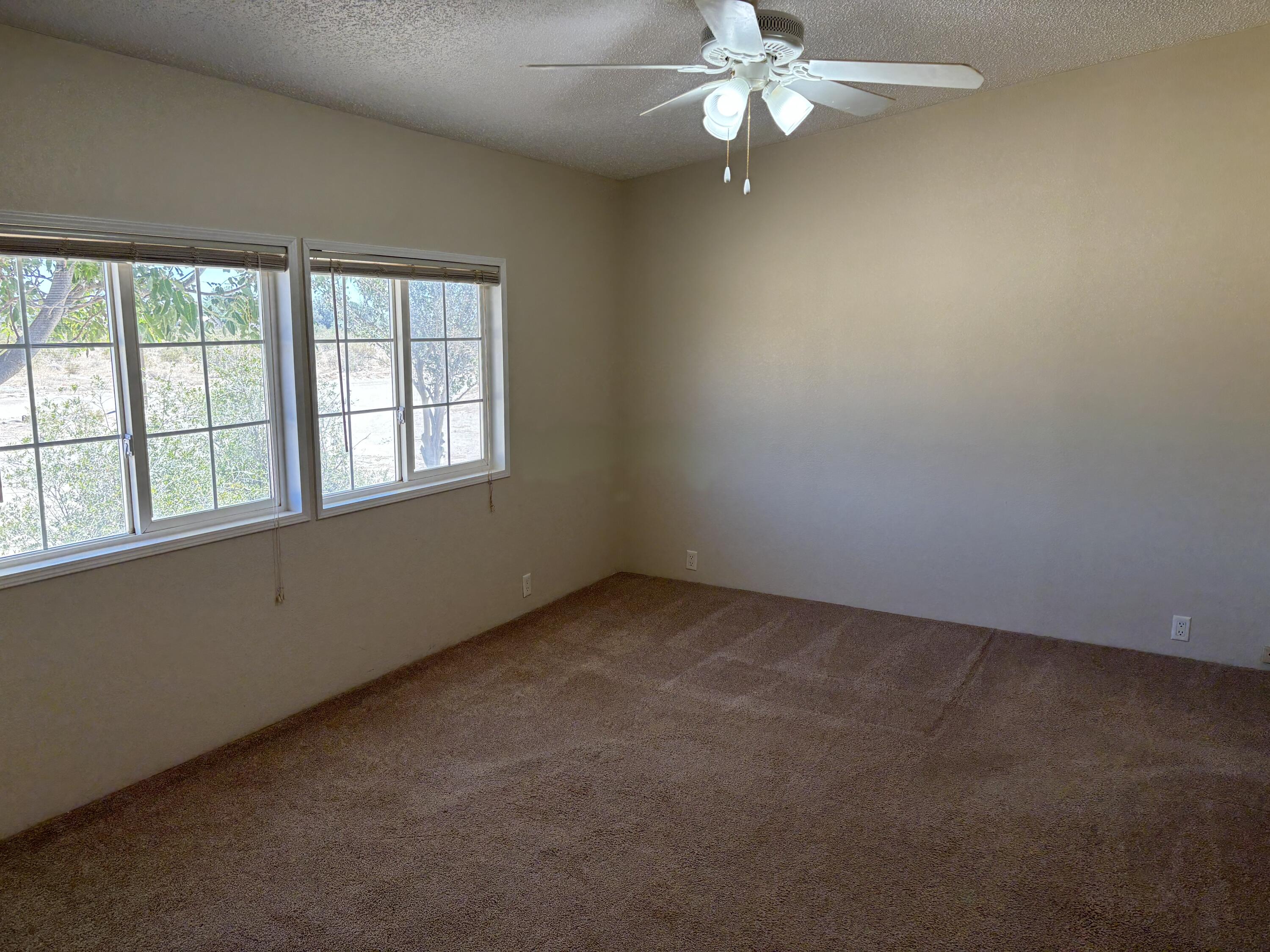 9073 Hull Street Mojave, CA 93501 - Photo 7 of 16 an empty room with a window