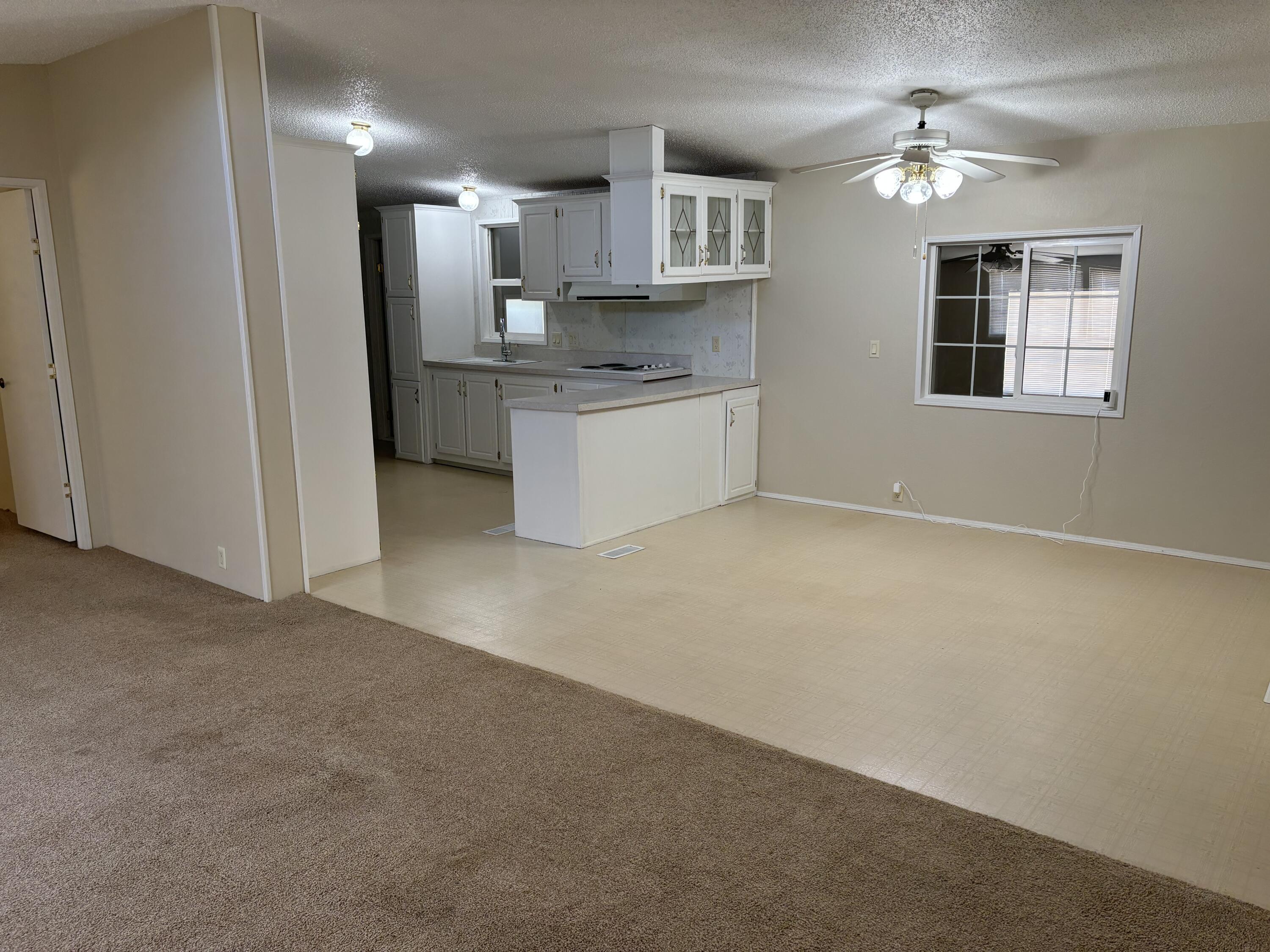 9073 Hull Street Mojave, CA 93501 - Photo 9 of 16 a view of a kitchen with a sink cabinets and a kitchen