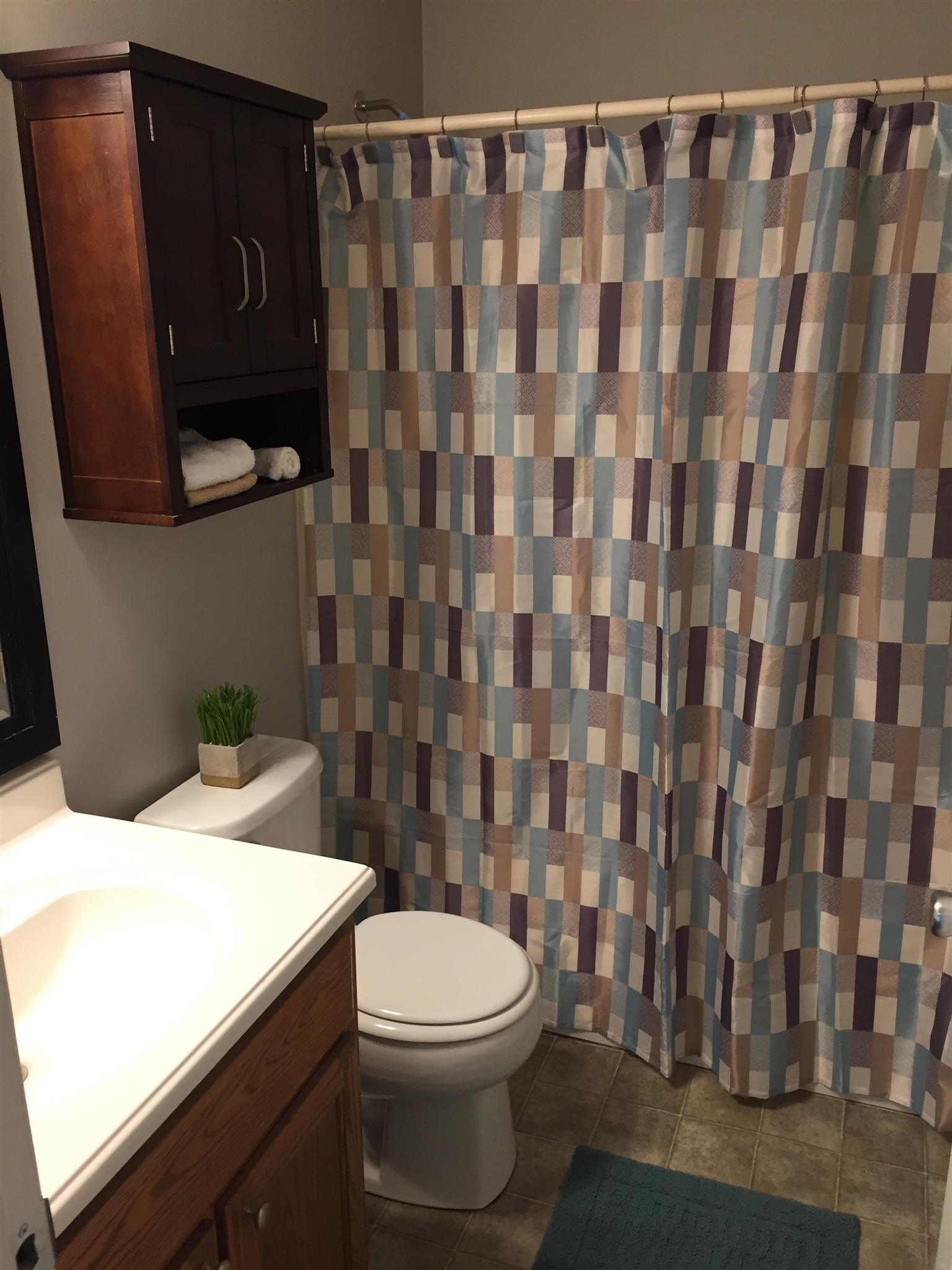 2308 Benay Road Nashville, TN 37214 - Photo 11 of 18 a bathroom with a toilet and a shower curtain