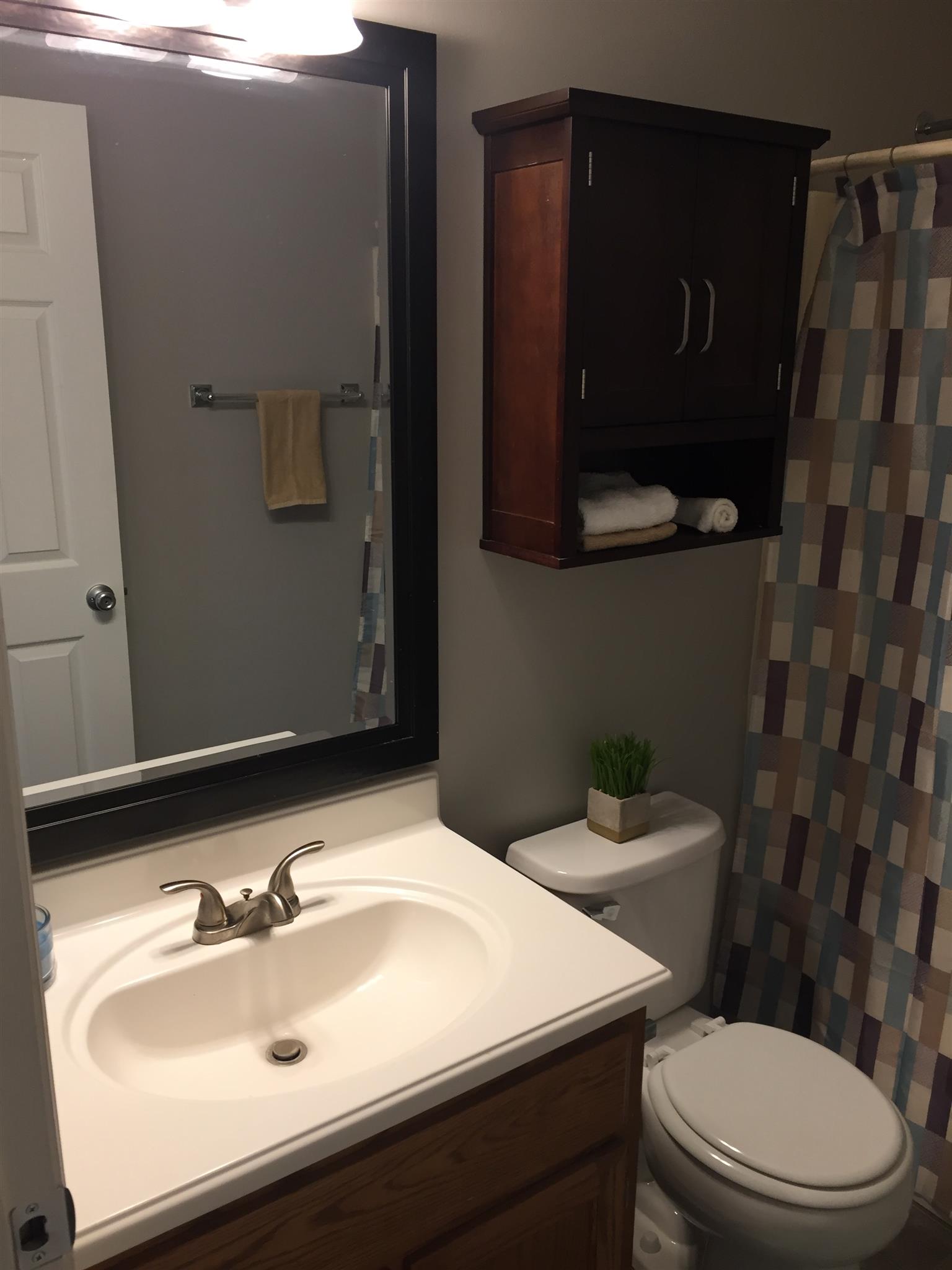 2308 Benay Road Nashville, TN 37214 - Photo 12 of 18 a bathroom with a sink toilet and mirror