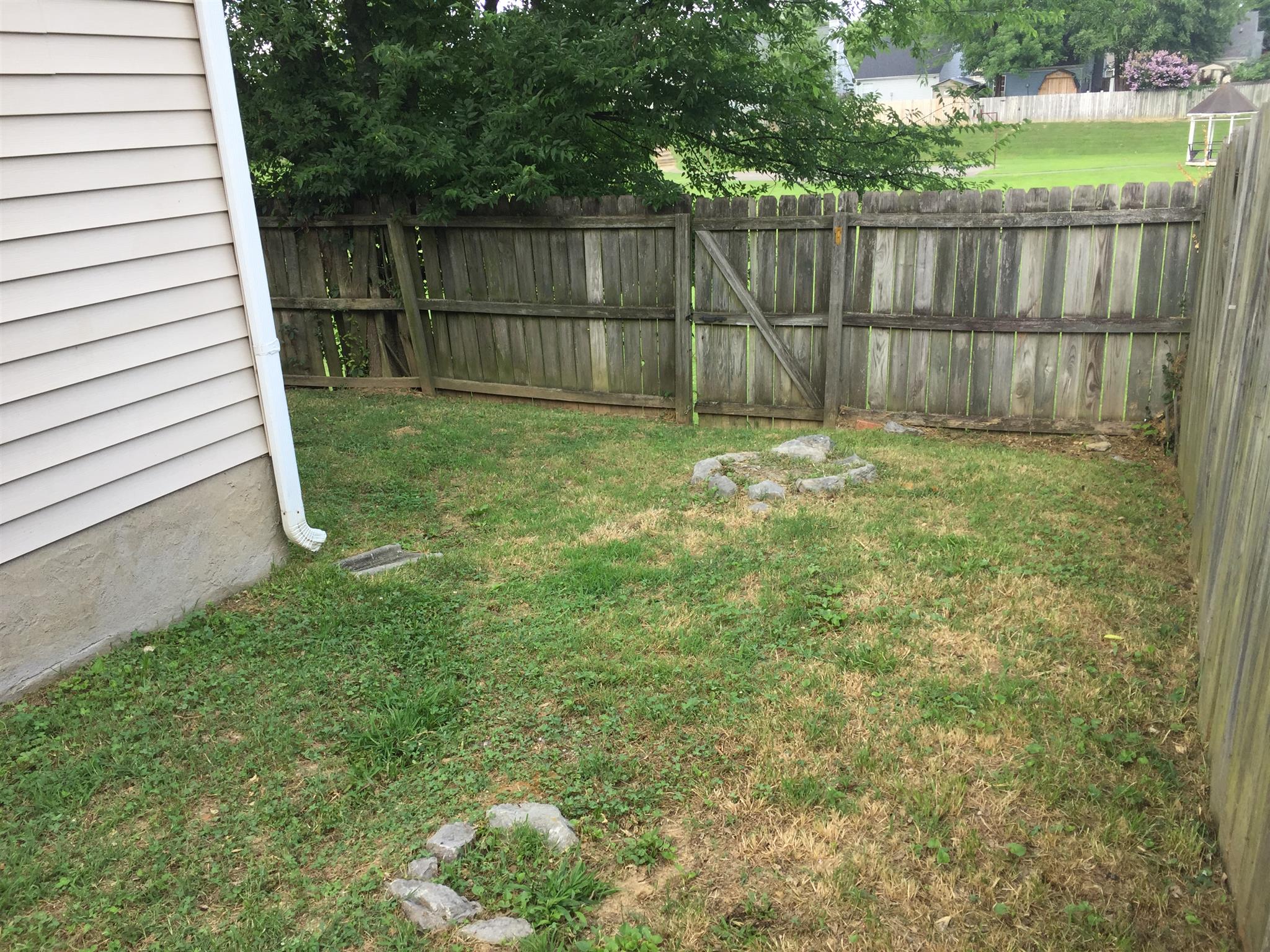 2308 Benay Road Nashville, TN 37214 - Photo 15 of 18 a view of a backyard with wooden fence