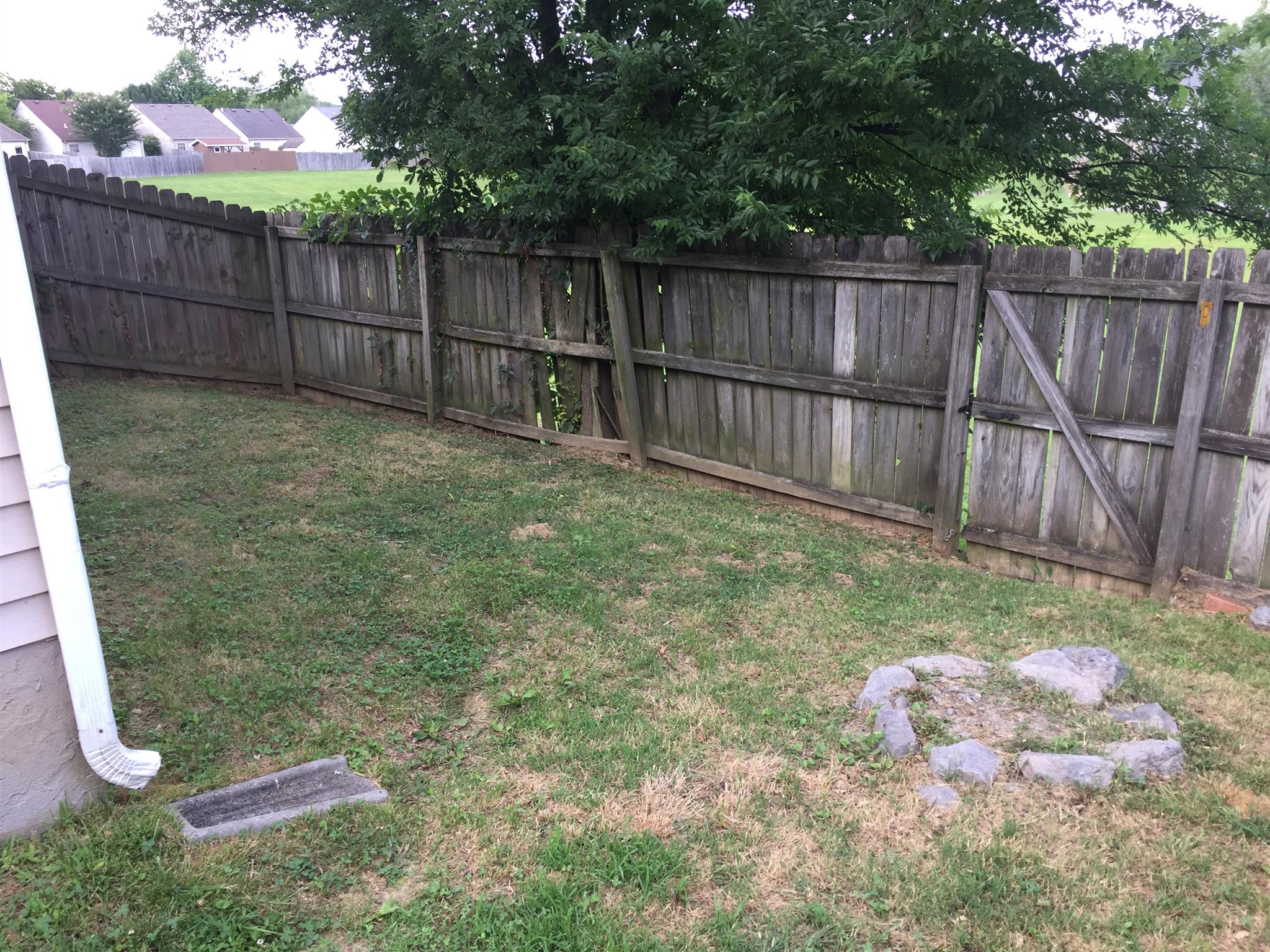 2308 Benay Road Nashville, TN 37214 - Photo 16 of 18 a backyard of a house with wooden fence