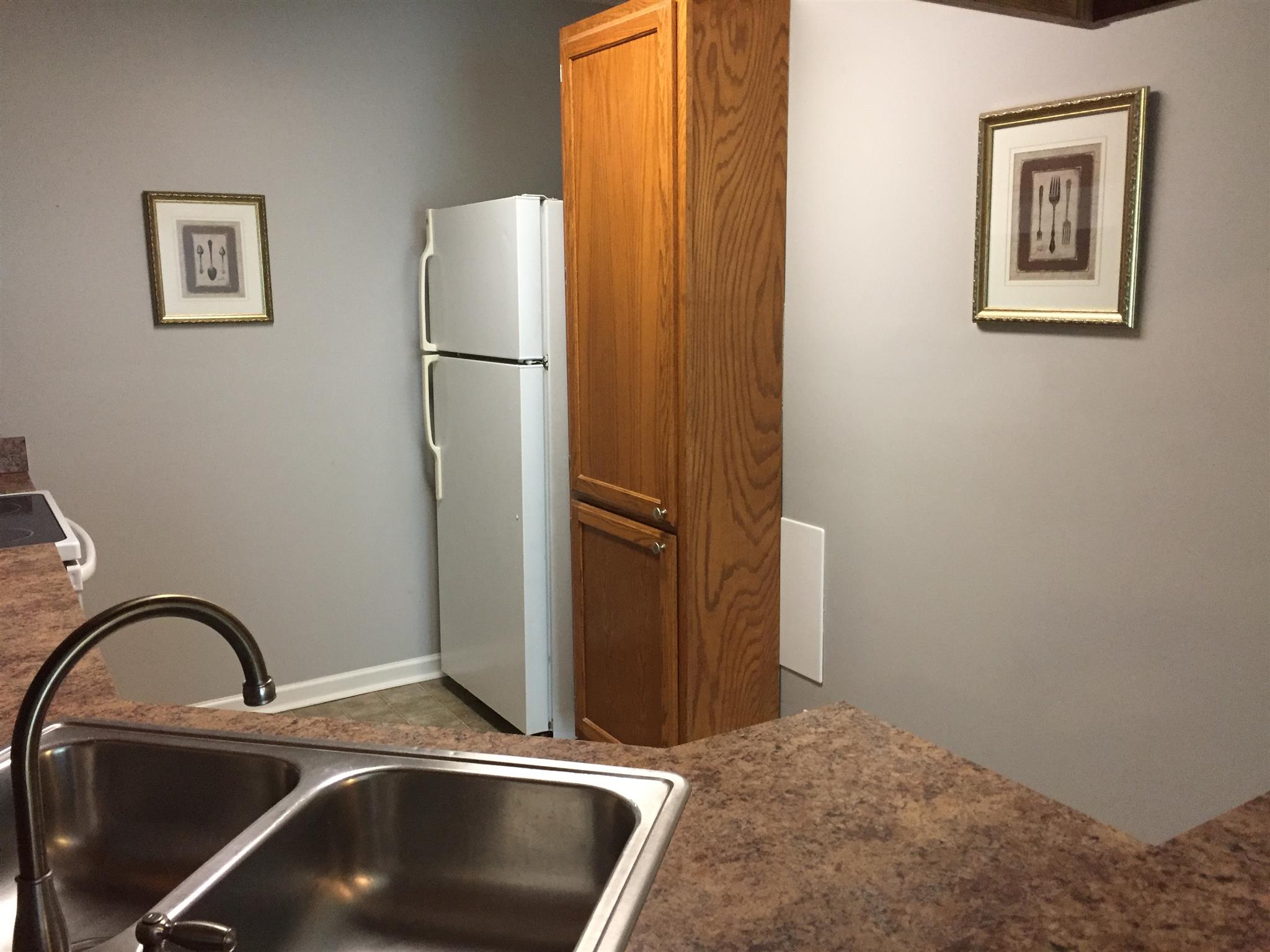 2308 Benay Road Nashville, TN 37214 - Photo 5 of 18 a kitchen with a refrigerator and a sink
