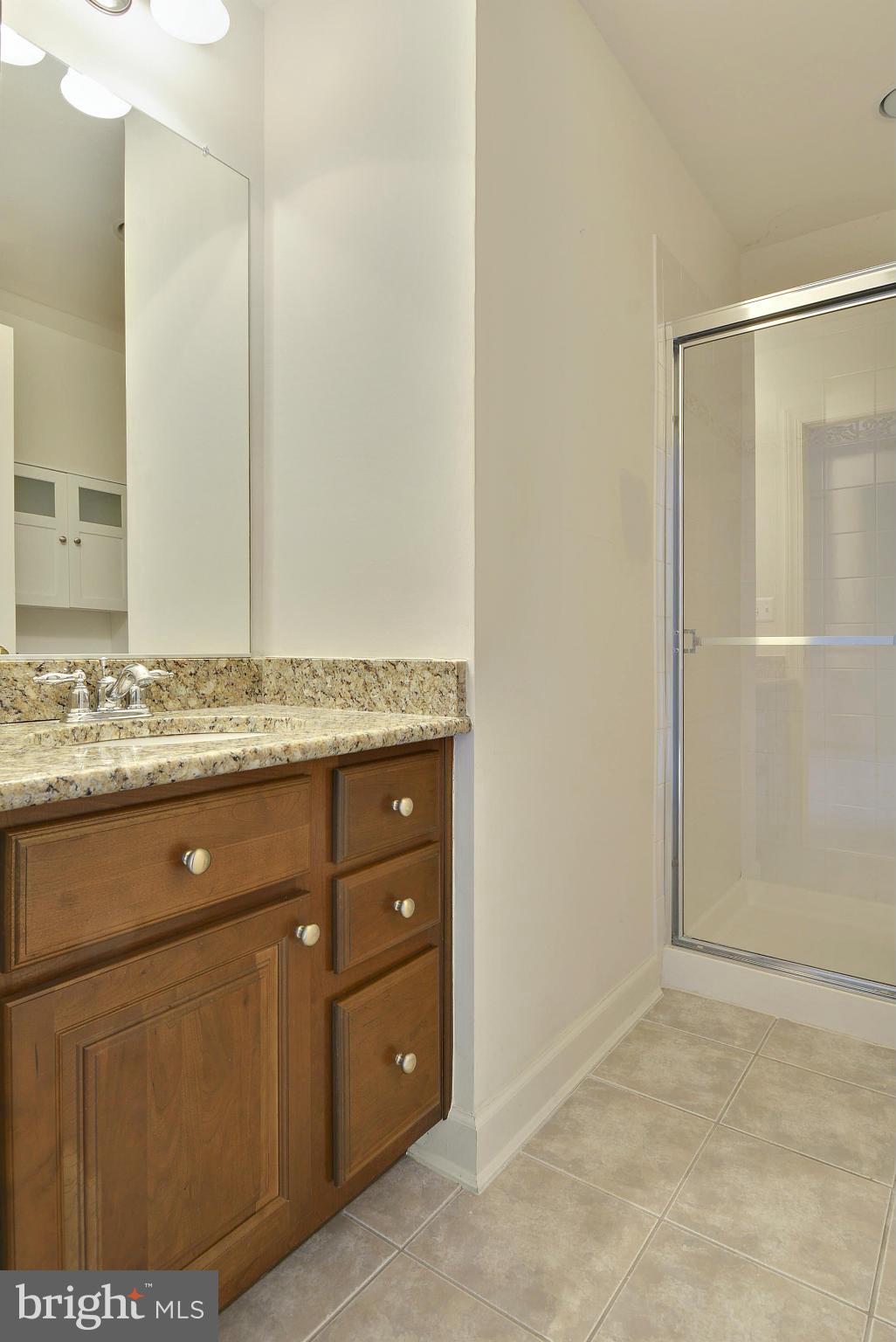 7976 Vigne Court Vienna, VA 22182 - Photo 20 of 30 Full bath in upper level with granite countertop.