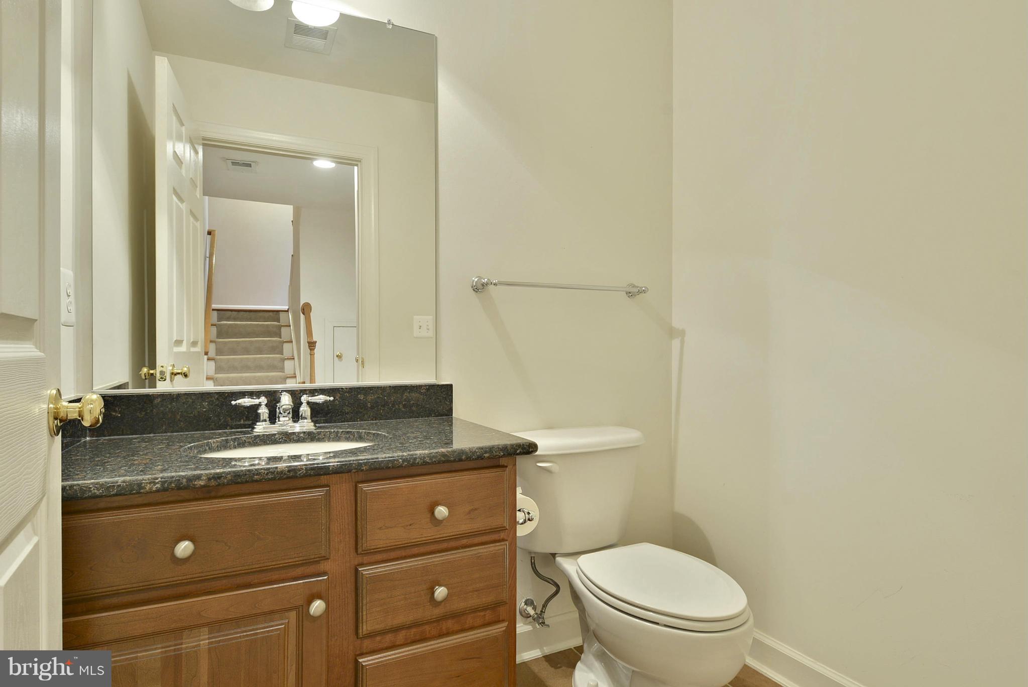 7976 Vigne Court Vienna, VA 22182 - Photo 22 of 30 Half bath in lower level with granite countertop.