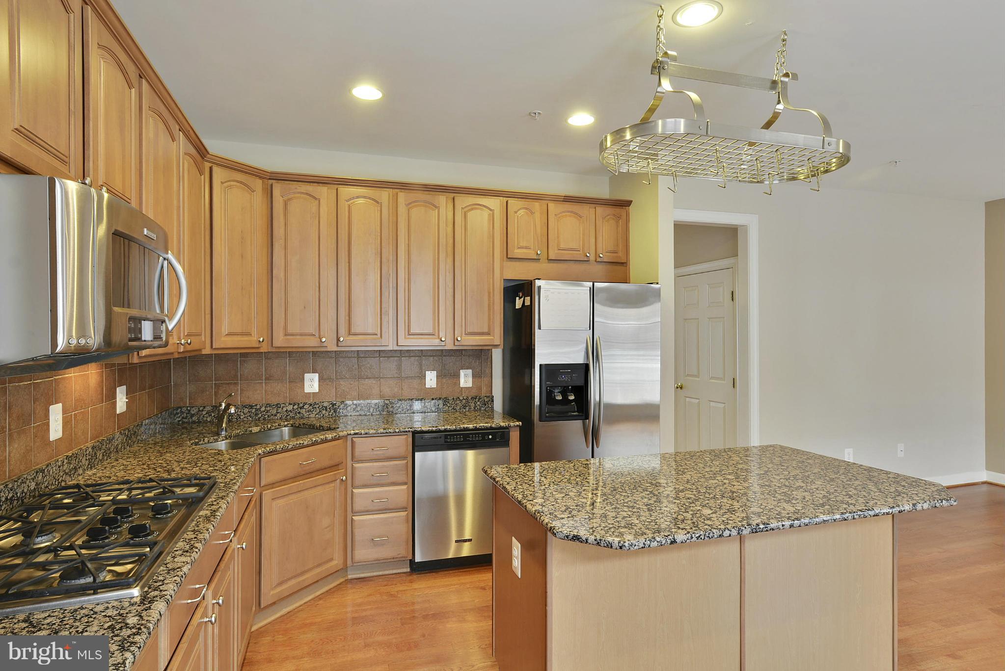 7976 Vigne Court Vienna, VA 22182 - Photo 6 of 30 Gourmet kitchen with hanging pot rack.