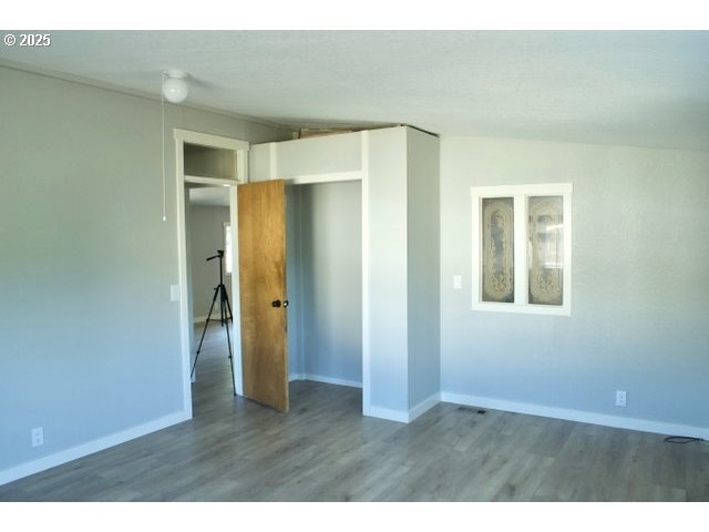 700 Northeast 183rd Avenue, Unit 7 Portland, OR 97230 - Photo 18 of 27 a view of an empty room with closet and a window