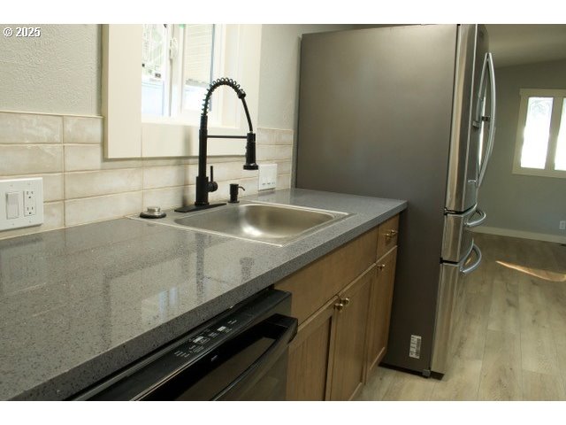 700 Northeast 183rd Avenue, Unit 7 Portland, OR 97230 - Photo 5 of 27 a close view of sink and tap