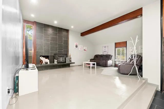 a bedroom with furniture and flat screen tv