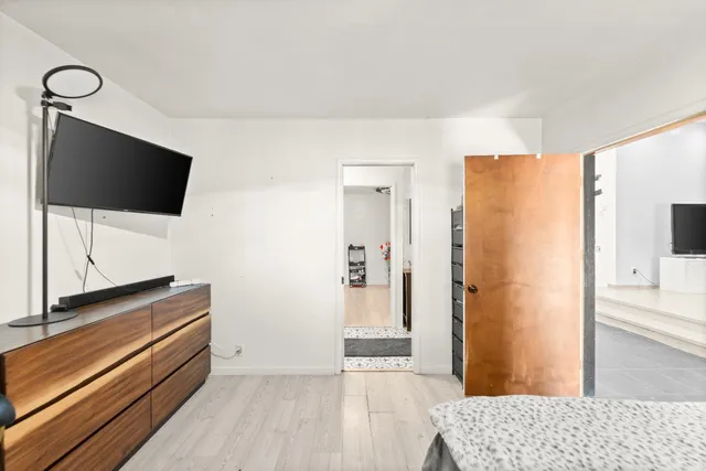 a view of a livingroom with furniture and a flat screen tv
