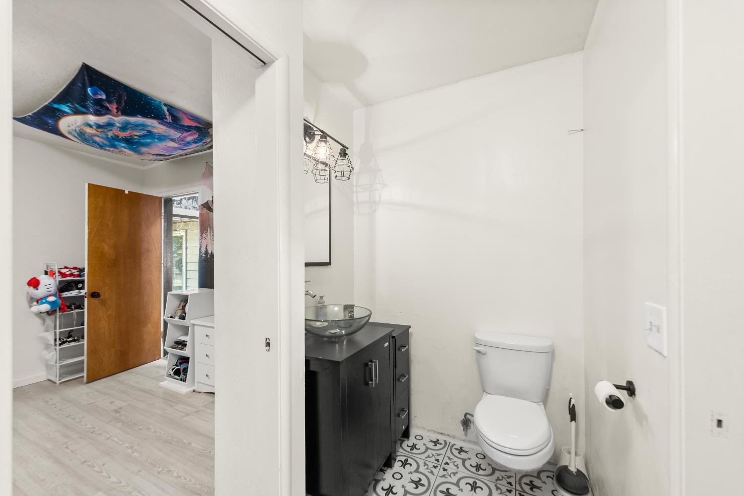 738 Webster Street Colusa, CA 95932 - Photo 18 of 56 a bathroom with a toilet sink and mirror