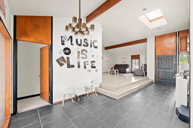 a view of a livingroom with furniture and window