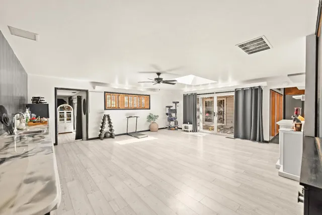 a kitchen with stainless steel appliances a refrigerator and a stove top oven