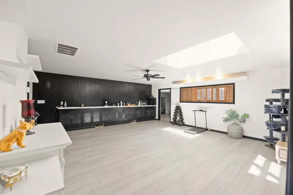 a kitchen with a refrigerator and a stove