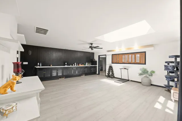 a kitchen with a refrigerator and a stove