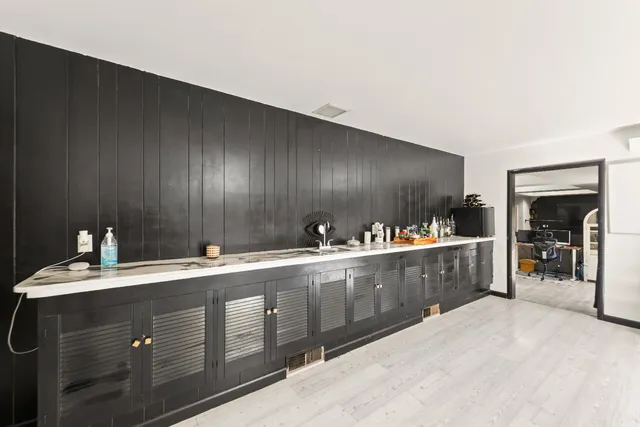 a view of a room with furniture and windows