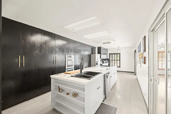 a view of a livingroom with furniture and gym equipment