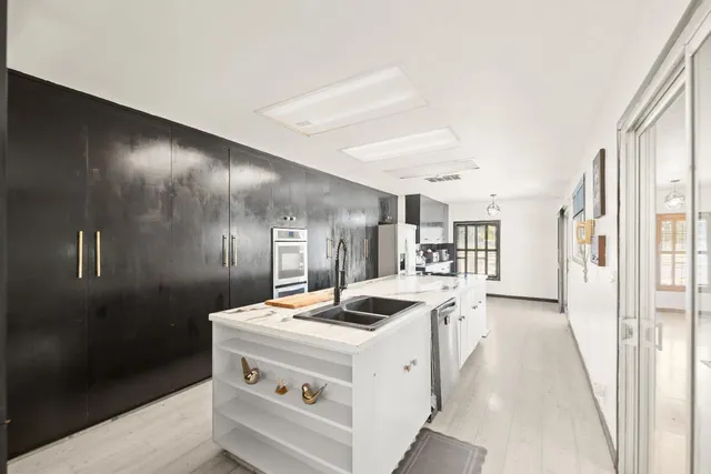 a view of a livingroom with furniture and gym equipment