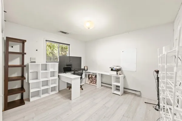 an aerial view of residential houses with outdoor space